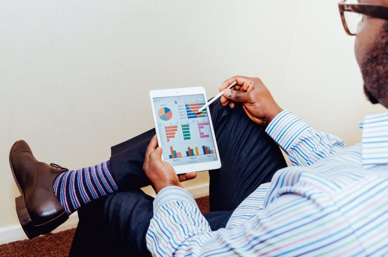 person examining metrics on ipad